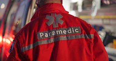 back-man-and-paramedic-walking-to-ambulance-for-e-2026-03-25-07-41-14-utc
